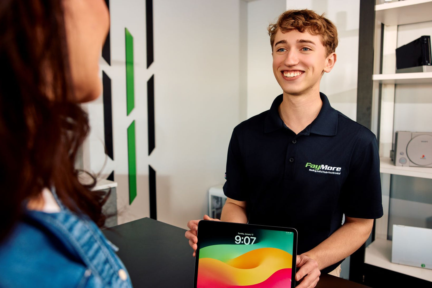 employee holding a tablet and smiling