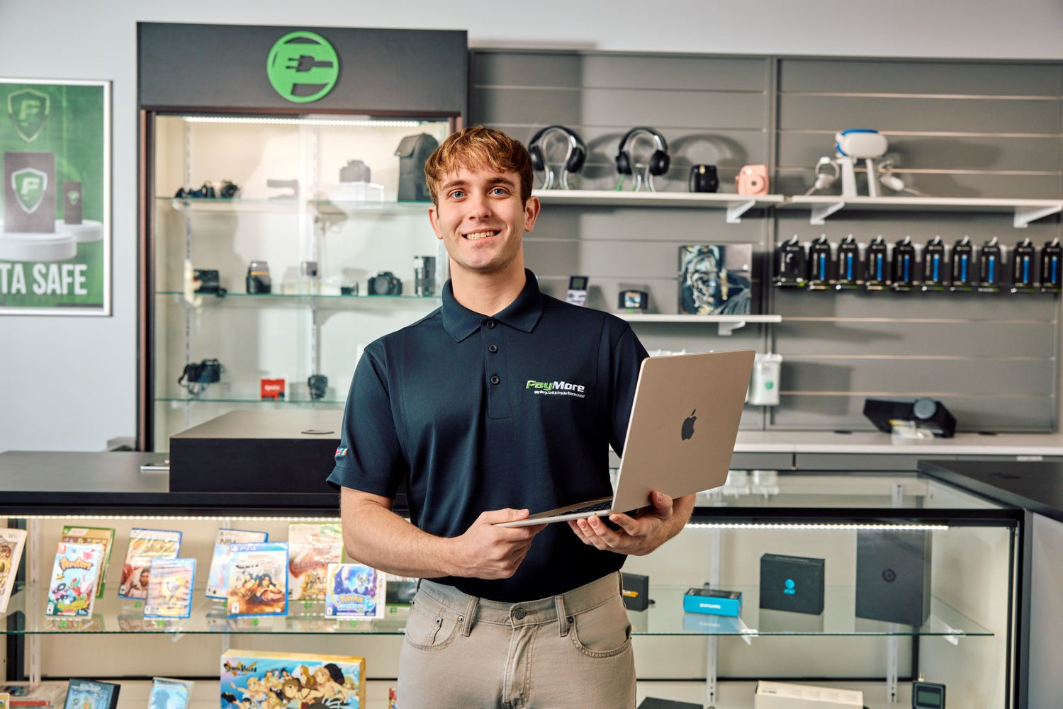 employee holding a laptop